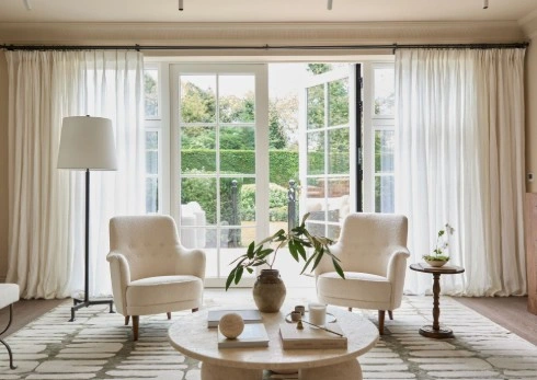 home staging services Apartment with big window sofa, table tv and concreate ceiling